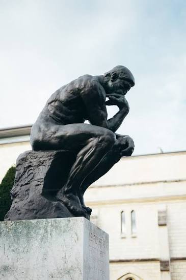 sitting man in granite stone